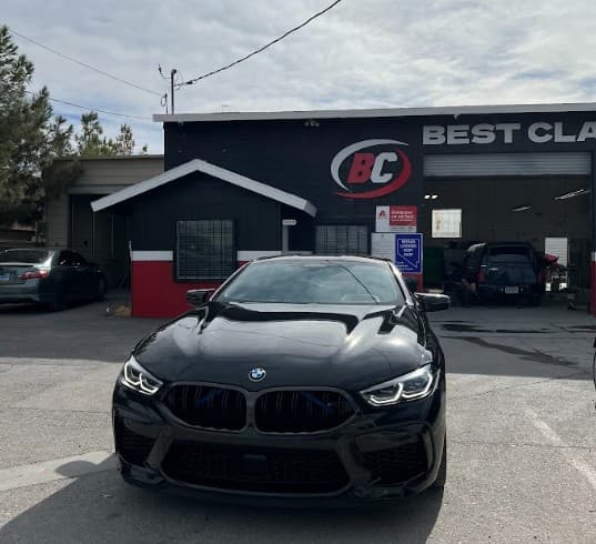 BMW M8 parked in front of Best Class Auto Body shop in Las Vegas