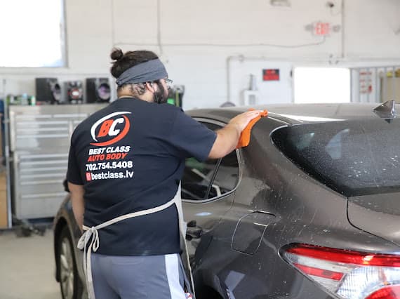 Auto body technician polishing vehicle at Best Class Auto Body Las Vegas