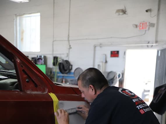 Best Class Auto Body shop in Las Vegas - certified technician working on vehicle