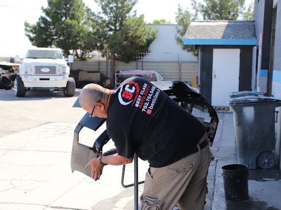 Auto body technician performing body work at Best Class Auto Body Las Vegas