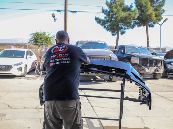 Best Class Auto Body technicians repairing collision damage outdoors Las Vegas