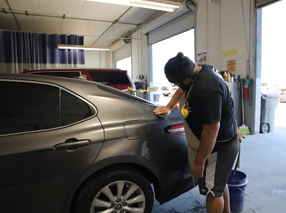 Auto body technician working inside Las Vegas repair shop