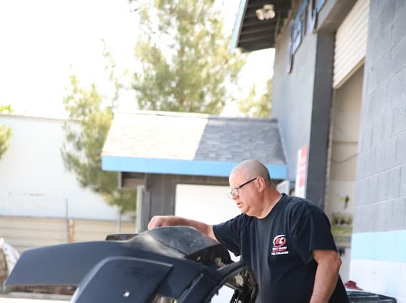 Auto body technician quality inspection outdoors at Best Class Auto Body Las Vegas
